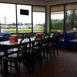 a woman sitting at a table in a restaurant