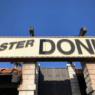 a sign for a donut shop