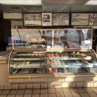 a display case filled with donuts