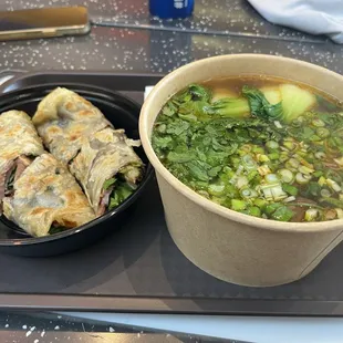 Braised beef noodles (no spice) $15 and beef roll $12.