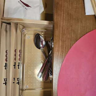 Drawer in table for cutlery