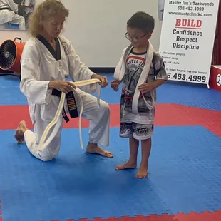 Master Nancy awarding a new belt
