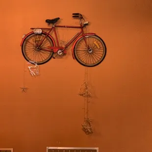 a bicycle hanging on a wall