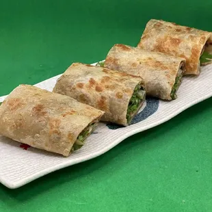 three burritos on a plate