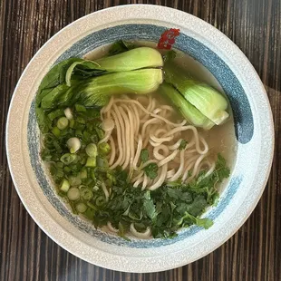 a bowl of noodles and vegetables