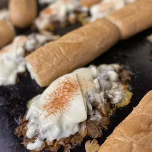 a close up of the cheesesteaks