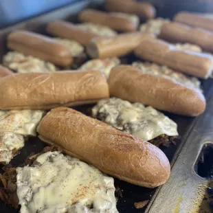 cheesesteaks on a grill