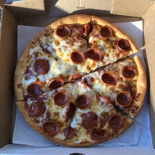 a pepperoni pizza in a box