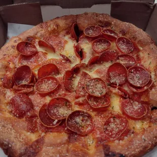 a pepperoni pizza in a box