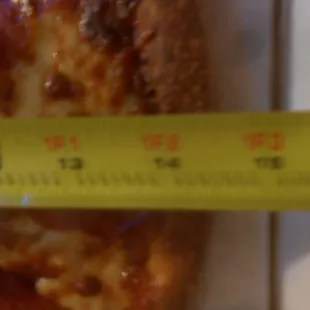 The 16-inch pizza measures just over 14 inches.