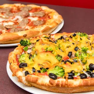 two pizzas on plates