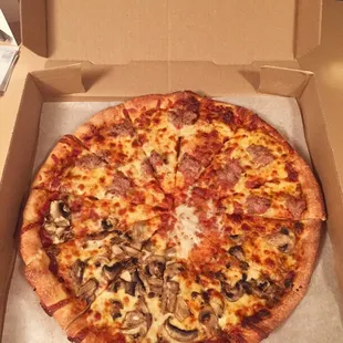 a whole pizza in a box