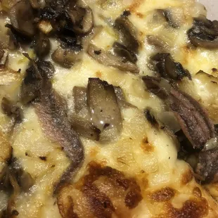 A Cleveland cheese stake with anchovies and a delivery drivers spit on it