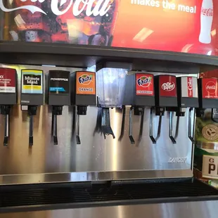 a soda dispenser in a restaurant