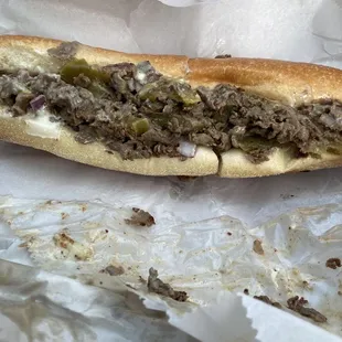 Cheesesteak w/ raw onions, sweet peppers, American cheese and mayonnaise