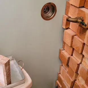a stack of wood blocks in a bathroom