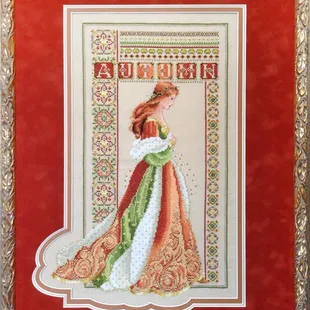 Look at this unique mat cut to enhance this needlework.