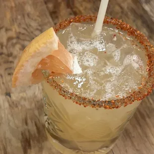 PALOMA (El Jimador, grapefruit soda, lime, tajin) with a chili-salt rim