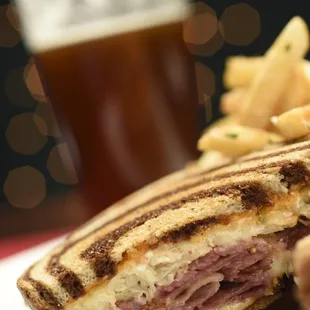 a ham and cheese sandwich with fries