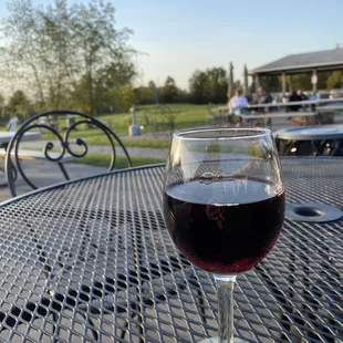 a glass of wine on a table