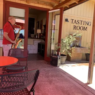 Ruggero playing his saxophone when entering the tasting room.
