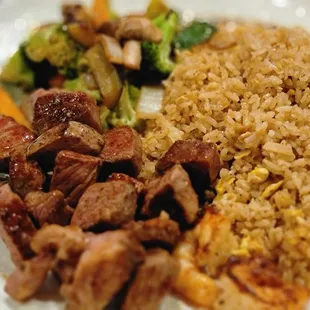 New York Strip steak, mixed vegetables and fried rice