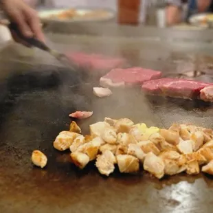 a person cooking on a grill