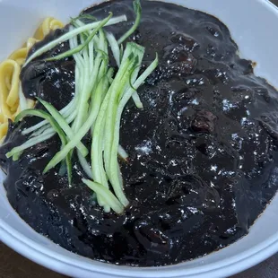 a bowl of black beans and noodles