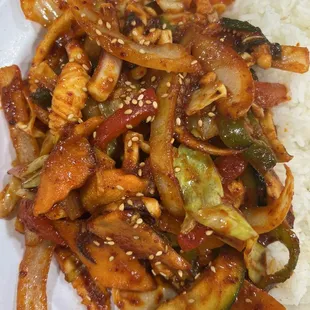 a plate of stir fried vegetables and rice
