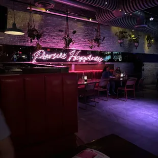 a bar with a neon sign