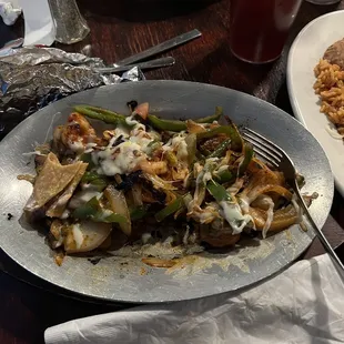 a plate of mexican food and a plate of rice