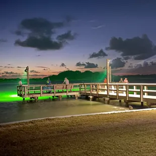 One of the two green lit piers