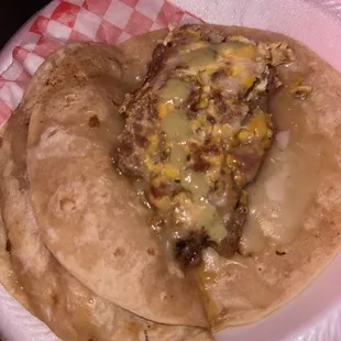 Egg, bacon, cheese with green salsa