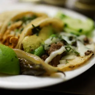&quot;Especial&quot; taco, $2 for a steak, avocado, cheese, cilantro, and onion taco!