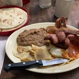 Huevos Rancheros with sausage and bacon