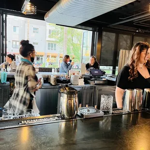 a woman behind the bar