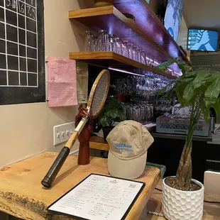 Tennis theme throughout, including a vintage racket at the bar and large screen (see top) showing matches on the Tennis Channel. Nice touch.