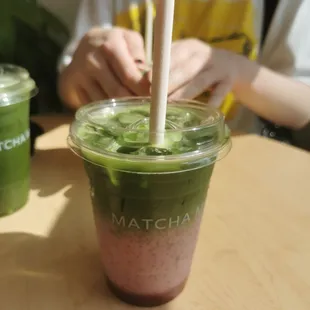 Strawberry Matcha Latte with edible strawberry straw (not vegetarian)