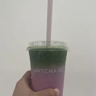 Strawberry matcha latte with edible strawberry straw