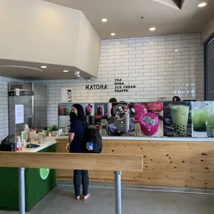 a woman standing at a counter