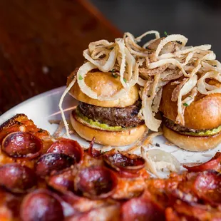 a plate of burgers and pizza