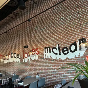 a brick wall with the word matchbox on it