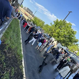 a crowd of people standing in line