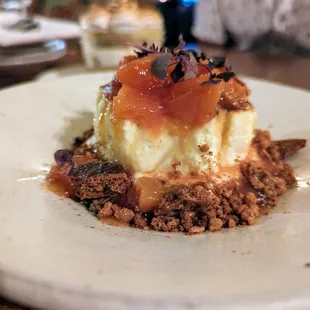 Basque Cheesecake. $10. Peach compote, Graham cracker streusel, peaches and cream cloud.