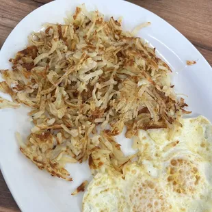 Hash browns and eggs over medium