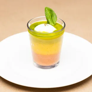 Caprese - 
Multi-layer heirloom tomatoes mousse, whipped burrata, basil infused extra-virgin olive oil, volcanic rock salt