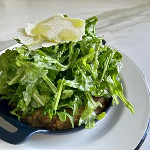 Frittata Spagnola- Soft Spanish-style omelette w/ sauteed potatoes, caramelized onions, topped w/ arugula, parmigiano cheese, lemon dressing