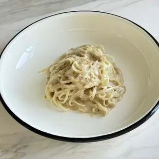 Tagliolini Bianchi - Truffled butter and parmigiano cheese sauce