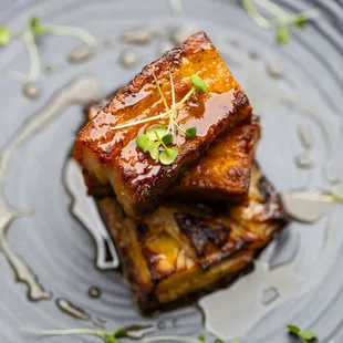 Pork Belly - 
Crispy slow braised pork belly, potatoes gratin, honey glaze, microgreens