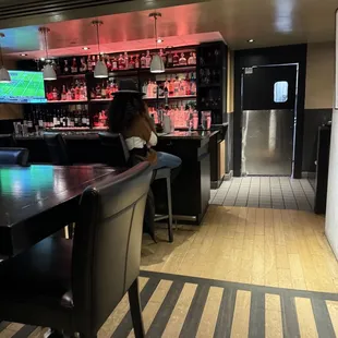 a woman sitting at a bar